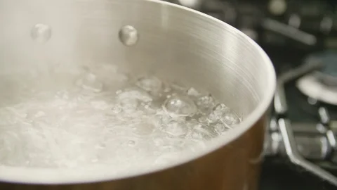 Closeup Of Water Boiling In Saucepan At Kitchen Stock Footage 86118034