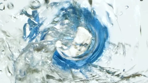 Closeup water falling down from bottle with drops splashing, slow motion video Stock Footage 157846301