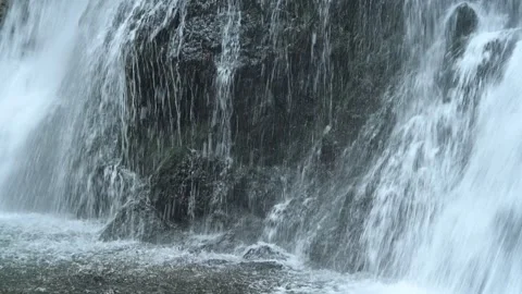 Closeup of water falling into the pond of a waterfall in autumn 스톡 동영상 288143092