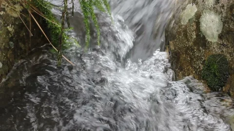 Closeup of Water Flowing Through Rocks in a Mountain Streams Stock Footage 50632954