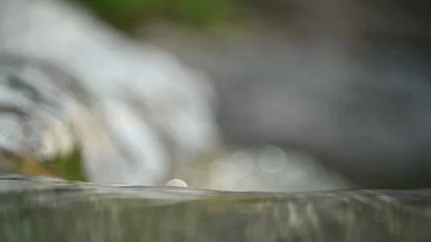 Closeup of water from a mountain river before it falls (bokeh) Video stock 212738180