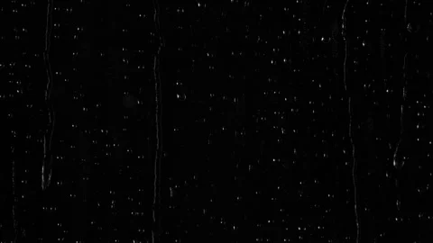 Closeup water rainfall, rain drops falling on window glass over black background Video stock 285822580