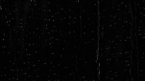 Closeup water rainfall, rain drops falling on window glass over black background 動画素材 286791830