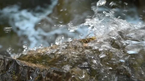 A closeup of water running over rocks (in slow motion) Stock-Footage 219646900