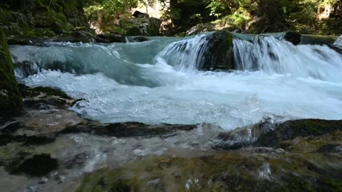 Closeup of water running over rocks of a mountain river  Stock-Footage 260867390