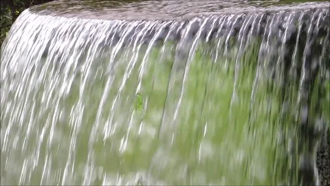 Closeup water running over surface, cascade, waterfall Stock Footage 93100558
