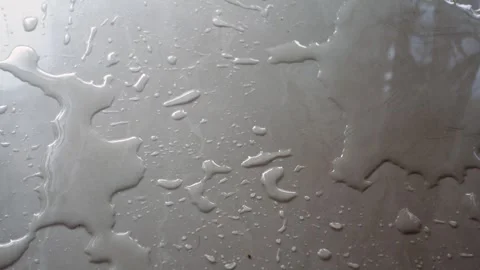 Closeup of water spilled on a tile floor . Stock Footage 342213697