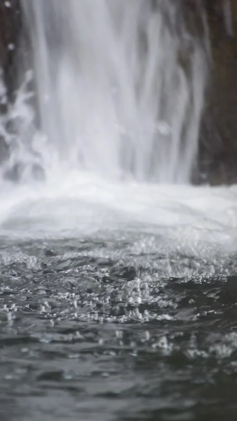 Closeup Of Water Splashing At Bottom Of Waterfall - Vertical Footage Stock Footage 343438275