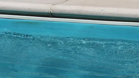 Closeup water waves against the wall of a swimming pool Stock Footage 311234044