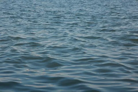 Closeup of a water waves background 写真素材