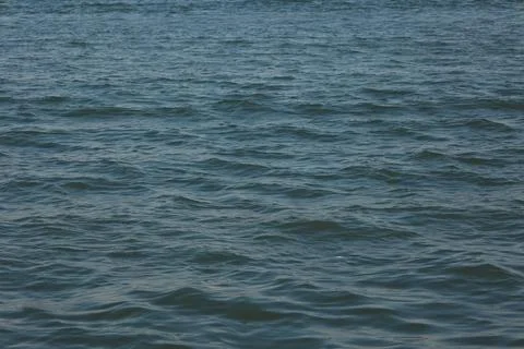 Closeup of a water waves background Stock Photos