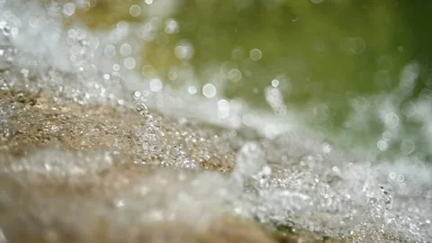 Closeup of a waterfall with beautiful bokeh (slow motion) 스톡 동영상 219635679