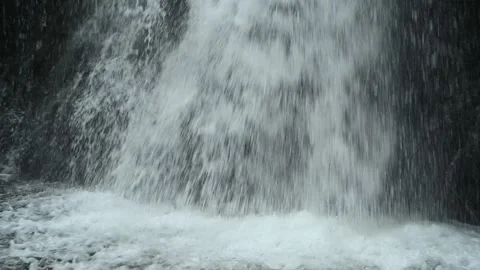 Closeup of a waterfall falling into a pond, slow motion Stock-Footage 288148922