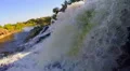 Closeup, waterfall falling into river, beautiful nature, sunset HD Footage