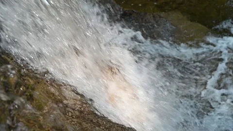 Closeup of a waterfall from a mountain stream (slow motion) Stock-Footage 219646932