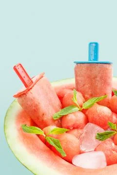 Closeup of watermelon popsicles on blue 스톡 사진