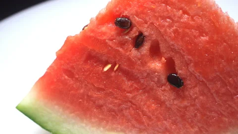 Closeup of watermelon slice rotated Видео 93021297