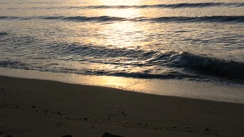 Closeup wave on the beach sunrise Stock Footage 154879219