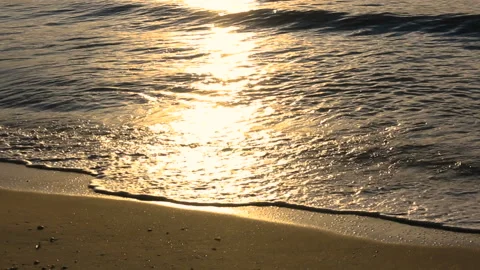 Closeup wave on the beach sunrise Stock Footage 154879234