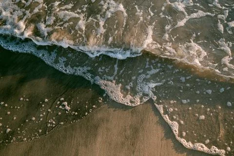 Closeup of waves at the beach Stock Photos