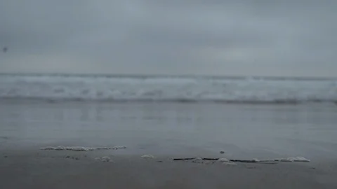 Closeup of waves on sand Stock Footage 125805271
