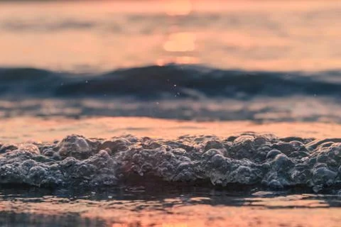 Closeup waves in the sunset Stock Photos