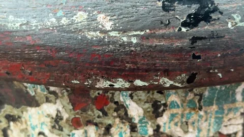 Closeup of weathered paint on a metal surface with vibrant red and turquois.. Stock Footage 340053159