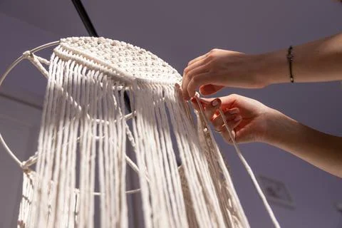 Closeup weaving of macrame threads , women's hands Stock-Fotos