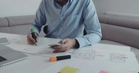 Closeup of webdesigner planning usability for mobile application Stock Footage 70309837