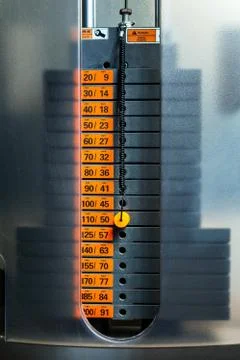 Closeup of weight stack with orange pin. Stock Photos