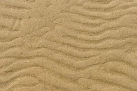 Closeup of wet sand pattern of a beach in the spring Stock Photos