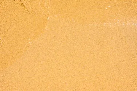 Closeup Of Wet Sand Texture Pattern On The Beach. Wave on clear sand beach. F Foto stock