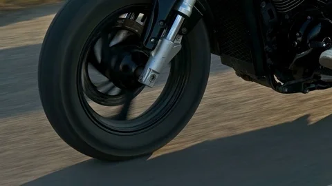 Closeup of a wheel of the motorcycle in motion,which goes to the motorcyclist on Stockbeeldmateriaal 78492250