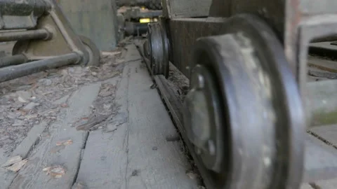 Closeup of wheels and rails. Transporting of raw, materials, products on rails. Stock Footage 89987947