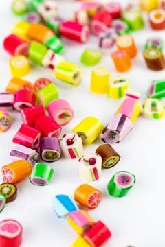 Closeup on white background in a small multi-colored sugar caramels with Stock Photos