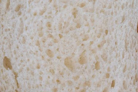 Closeup white bread texture, porous surface. Porous soft loaf surface with sc Stock Photos