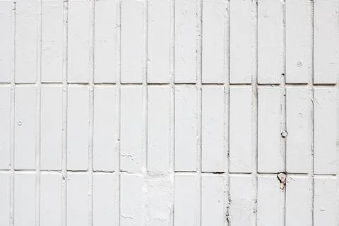 A closeup of a white brick wall with a distinctive grid pattern 写真素材