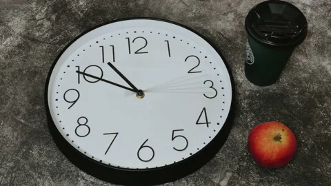 Closeup of White Clock Face in timelapse in daytime of office dark grey wall Video stock 151520625
