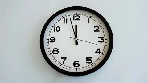 Closeup of White Clock Face on white wal... | Stock Video | Pond5