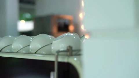 Closeup of White Coffee cups in Raw in beautiful cafe Interior, Slow motion 스톡 동영상 250981559