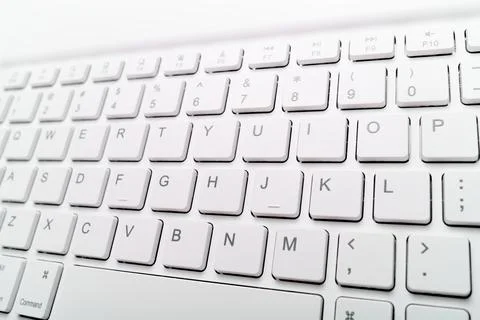 Closeup of a white computer keyboard with a wireless connection Stock Photos