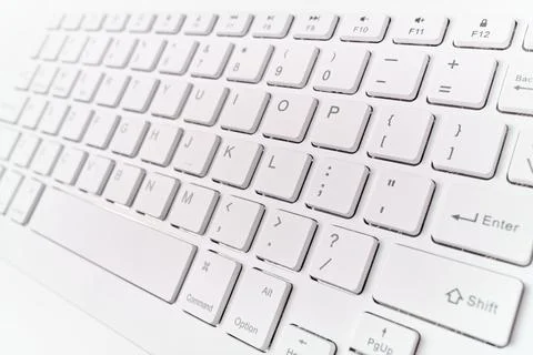 Closeup of a white computer keyboard with a wireless connection Stock Photos