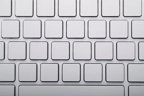 Closeup of a white computer keyboard with a wireless connection and blank key Foto stock