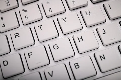Closeup of a white computer keyboard with a wireless connection Stock Photos