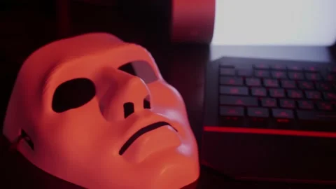 Closeup at the white mask lying on the working place of a programmer, coder Video stock 147667865