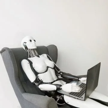 Closeup of white plastic robot working with laptop while sitting in armchair Foto stock