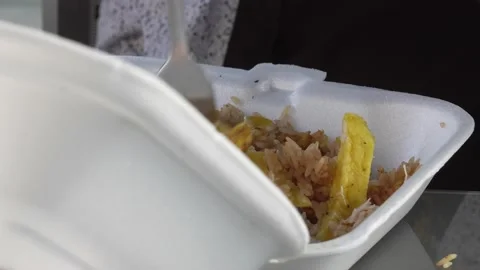 Closeup of a white plastic taper with rice and potato food eating with a fork Stock-Footage 161951582