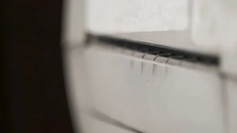 Closeup of a white printer printing a barcode sticker for a product. Stock Footage 169351486