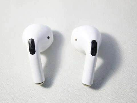 Closeup white TWS (true wireless stereo) earbuds Stock Photos