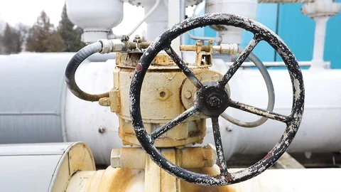 Closeup of white valve on pipe to shut off liquids, gas or air in industrial Stock Footage 121371491
